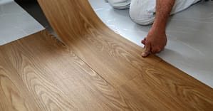 Floor expert laying vinyl flooring